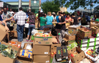 Volunteers setting up the produce section at the Community Solidarity Hempstead Food Share