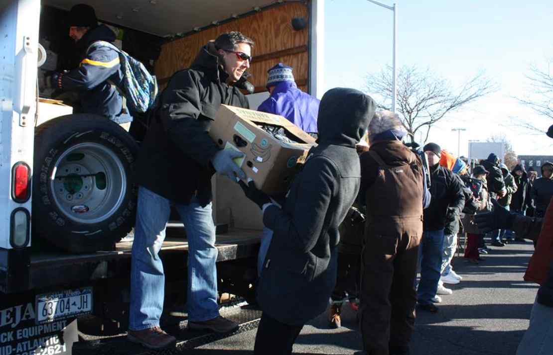 Unloading trucks of donations at the Community Solidarity Hempstead Food Share